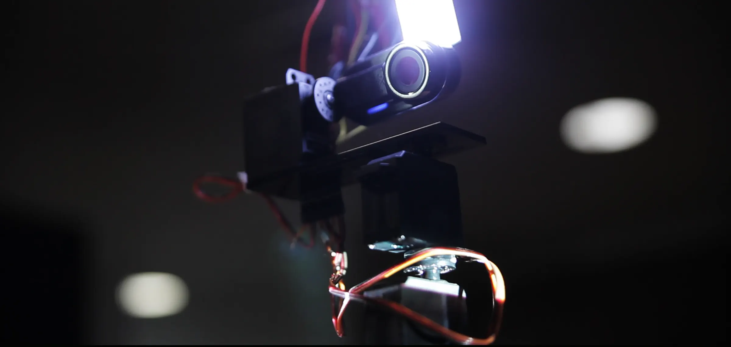 Close up of a webcam with a mounted LED lamp