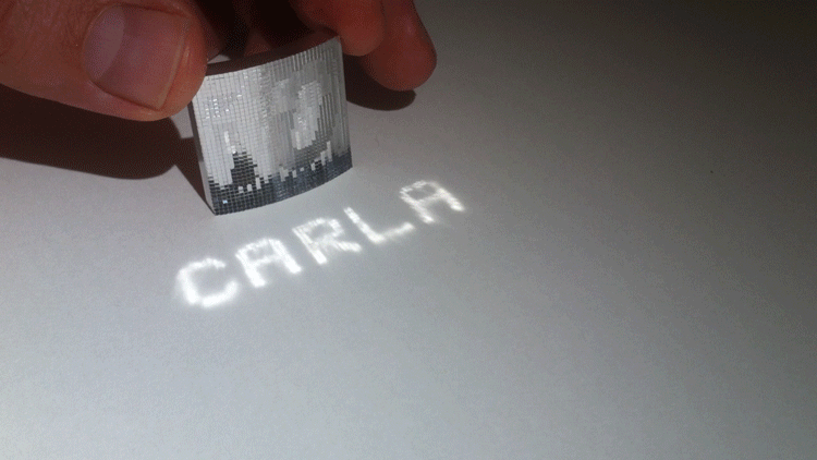 A facette surface which projects the word Carla.
